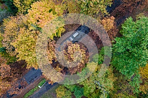 Aerial view on a road in autumn forest