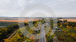 Aerial view of road at autumn forest in Almaty