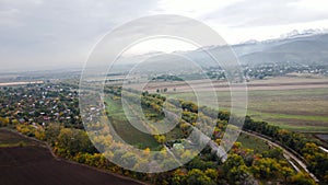 Aerial view of road at autumn forest in Almaty