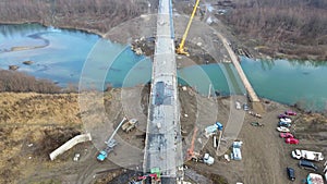 Aerial view of a road bridge under construction. road and bridge under construction. view from the sky. Modernization of