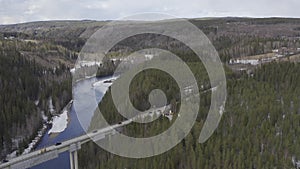 Aerial view of a road in fir forest in the Swedish Lapland