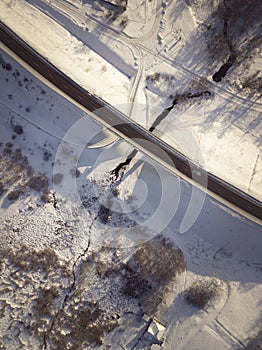 Aerial view on road and forest landscape in winter season