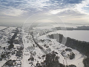 Aerial view on road and forest landscape in winter season