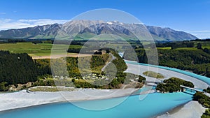 Aerial view with road of highway as bridge at Rakaia River lagoon Valley as green field againts with blue sky