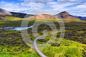 Aerial view on road in Iceland. Aerial landscape above highway in the geysers valley. Icelandic landscape from air. Famous place.