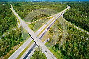 Aerial view of road interchange surrounded by forest in Finland, Northern Europe