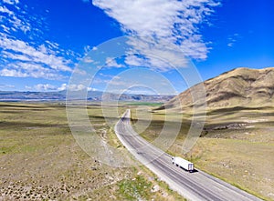 Aerial view of the road leading to Dogubayazit from Igdir. Plateau around Mount Ararat, mountains and hills. Eastern Turkey