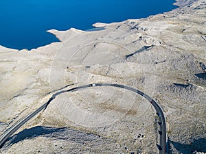 Aerial view of the road through the moonscape of Pag island