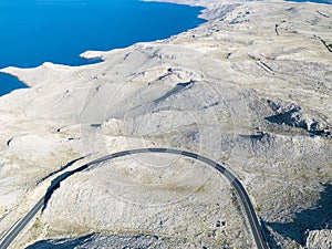 Aerial view of the road through the moonscape of Pag island