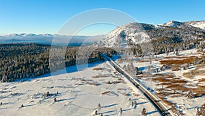 Aerial view of a road in mountains above Lake Tahoe