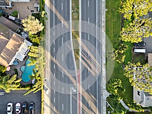 The aerial view of a road with road lines and buildings.