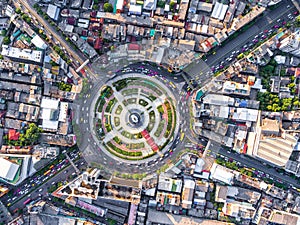 Aerial view Road roundabout with car lots Wongwian Yai in Bangkok,Thailand.street large beautiful downtown at night.cityscape.