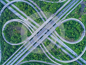 Aerial view, Road roundabout, Expressway with car lots in the ci
