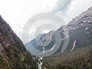 Aerial view of road surrounding mountains. Dolomites. Monte Piana Dobbiaco South Tyrol Italy