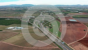 Aerial view. Road traffic highway and overpass with cars and trucks, interchange, two-level road junction in the big