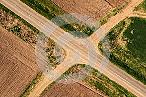 Aerial view of roadway and dirt road intersection