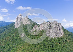 Aerial view. Rock massif. Forest covered a large rock. photo