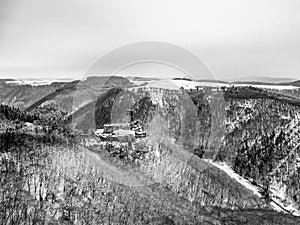 aerial view rock with medieval castle Ehrenburg near moselle river Brodenbach white winter snow wonderland forest hills