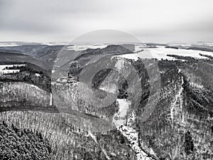 aerial view rock with medieval castle Ehrenburg near moselle river Brodenbach white winter snow wonderland forest hills