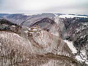 aerial view rock with medieval castle Ehrenburg near moselle river Brodenbach white winter snow wonderland forest hills