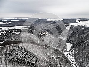 aerial view rock with medieval castle Ehrenburg near moselle river Brodenbach white winter snow wonderland forest hills