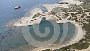 aerial view of the rock of S\'Archittu di Santa Caterina in the province of Oristano, Sardinia, Italy