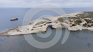 aerial view of the rock of S\'Archittu di Santa Caterina in the province of Oristano, Sardinia, Italy photo