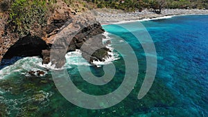 Aerial view with rocks, stones and blue ocean at Bali