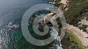 Aerial view of the rocky beach with pieces of rocks near the town of Bonifacio on the island of Corsica