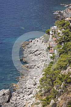 Aerial view of rocky shoreline on the Tyrrhenian Sea nearby Marina Piccola, Capri Island, Italy