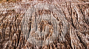 Aerial view on rocky spikes of salt mine in the middle of amazon jungle.