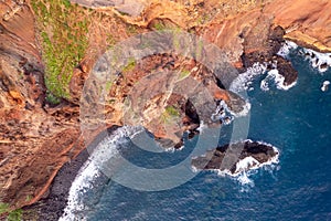 Aerial view of Rocky terrain along ocean shore in Madeira Island in Europe