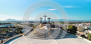 Monte Calvario and three crosses against blue sky view photo