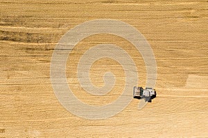 Aerial View. Roller steamroller or vibratory roller machine working on road construction site of new road. Highway