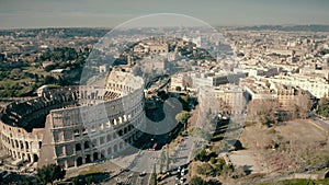 Aerial view of Roman cityscape involving famous Colosseum amphitheatre, Italy