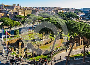 Aerial view of Roman historical buildings, Ancient Ruins, Coliseum and Imperial Forums Street Via dei Fori Imperiali