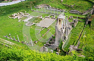 Aerial view of the Roman Theatre ruins in the green field