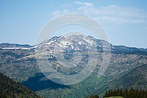 aerial view of romanian mountains range covered by snow