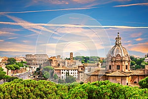 Aerial view of Rome, the dome and the Coliseum in the backyard, Italy