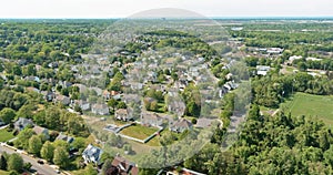 Aerial view roofs of the near a river town houses East Brunswick in the urban landscape of a small sleeping area New