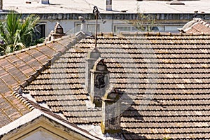 Aerial view of rooftop chimneys.