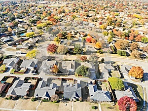 Aerial view row of new house with cul-de-sac dead-end and bright orange color fall foliage near Dallas