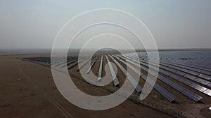 Aerial view of rows of solar panels. Video from the air.