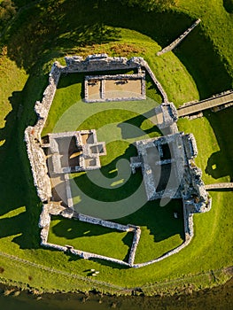 Aerial view of a ruined Norman conquest era castle in Wales Ogmore Castle