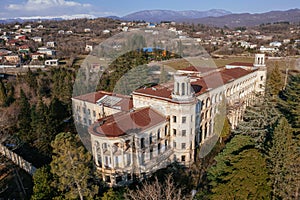 Aerial view of ruined overgrown old abandoned Soviet sanatorium Iberia, Tskaltubo, Georgia