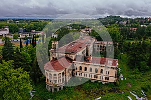 Aerial view of ruined overgrown old abandoned Soviet sanatorium Iberia, Tskaltubo, Georgia