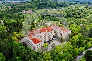 Aerial view of ruined overgrown old abandoned Soviet sanatorium Metallurgist, Tskaltubo, Georgia photo