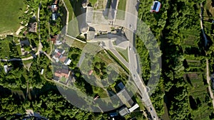 Aerial view of the ruins of a large medieval castle in Europe.