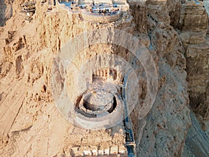 Aerial view  of the ruins of Massada is a fortress built by Herod the Great on a cliff-top off the coast of the Dead Sea.