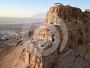 Aerial view  of the ruins of Massada is a fortress built by Herod the Great on a cliff-top off the coast of the Dead Sea.